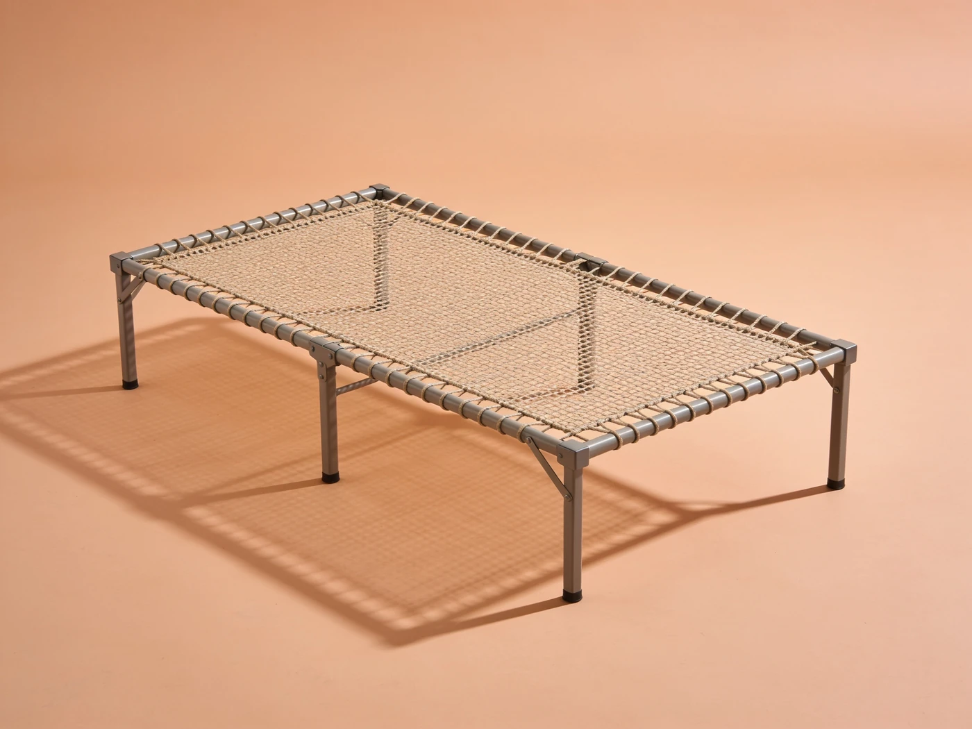 Raised mesh sleeping cot — Powder-coated steel frame, woven polyester mesh